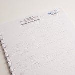 Image showing a sample braille mortgage statement with GBC comb binding by Braille Works