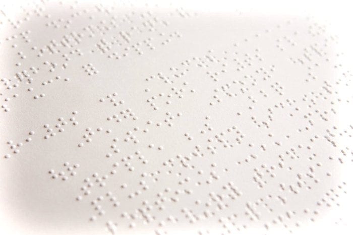 Image showing a close-up view of a Braille Document by Braille Works with faded borders.
