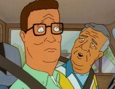 Hank Hill riding on the passenger-side of a car after being blinded during episode of King of the Hill