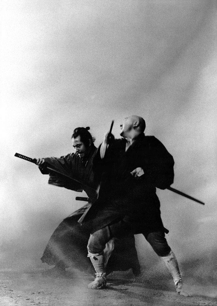 Black and white image showing Zatoichi in a swordfight with an adversary