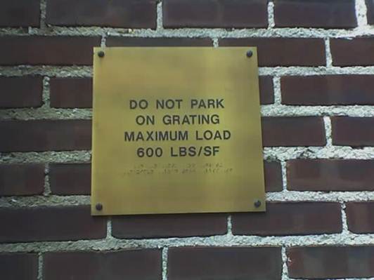 A "Do Not Park" sign in print and braille