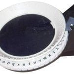 Image showing a close-up view of a Braille label maker showing the print letter with the corresponding Braille characters.