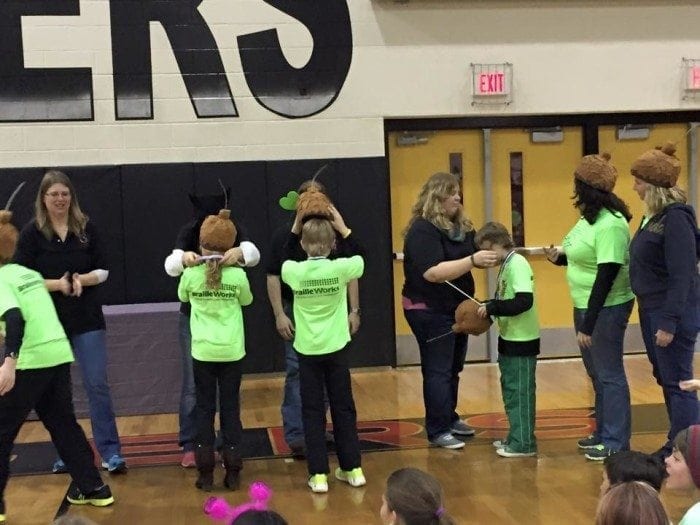 Image showing several Odyssey of the Mind participants receiving award medals at the end of the competition. Image showing several Odyssey of the Mind participants receiving award medals at the end of the competition.