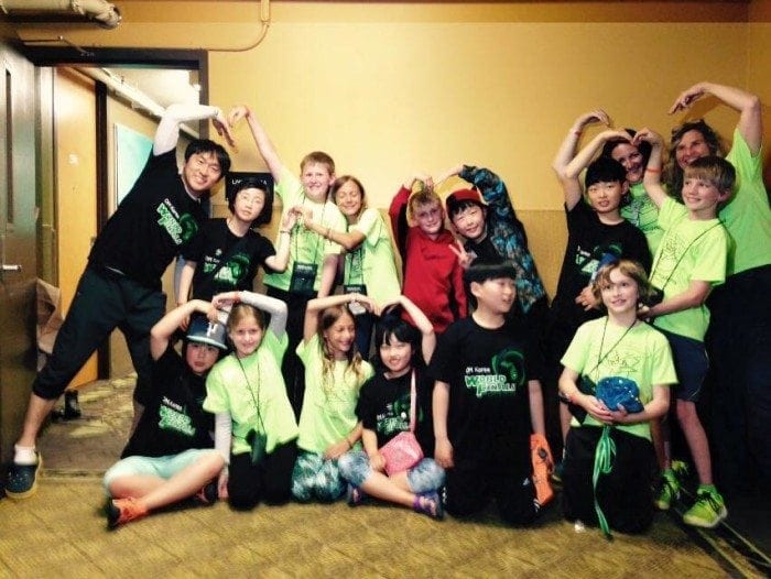 Seventeen members of the odyssey of the mind team posing with their arms above their heads in a funny manner. Seventeen members of the odyssey of the mind team posing with their arms above their heads in a funny manner.