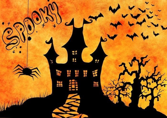 Scary Halloween castle with bats and spiders all around.