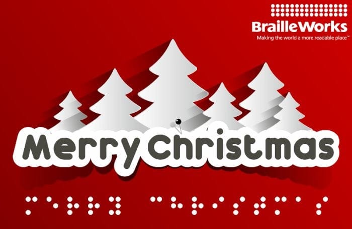 Merry Christmas displayed in print and Braille with white Christmas trees in the background.
