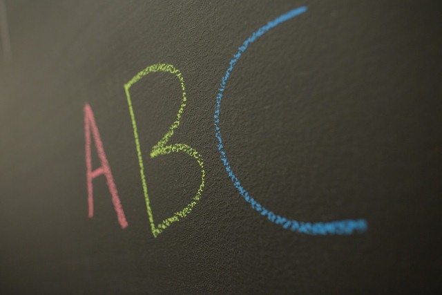 Chalkboard with a large A, B and C written in colored chalk.