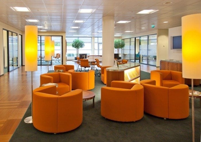 Bank lobby with modern style chairs, lamps and conference tables