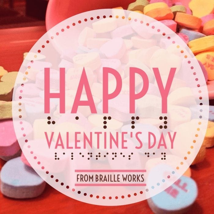 Happy Valentine's Day from Braille Works displayed in print and Braille with candy hearts in the background