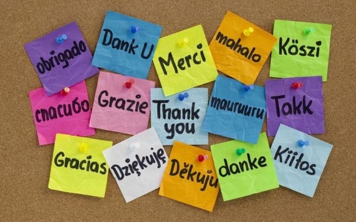 Post-it notes with the words "thank you" written on them in 15 different languages.