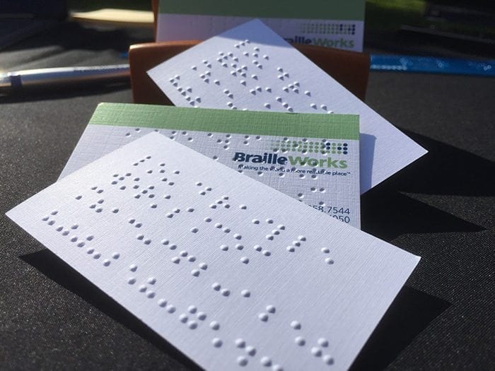 Stack of Braille business cards.