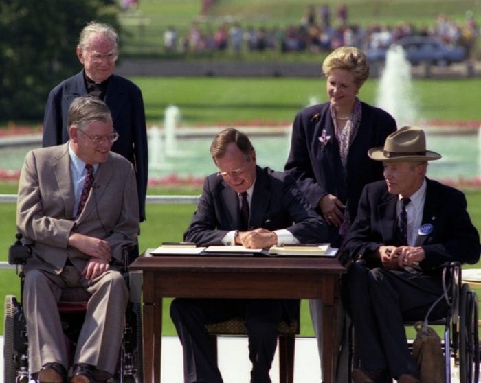 President Bush signs the Americans with Disabilities Act on the South Lawn of the White House.