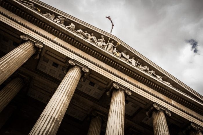 Close-up of the front of a government building with columns