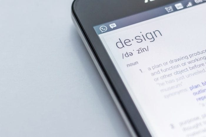 a cell phone with the word design and its definition