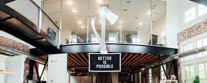 Office space with a "Better is Possible" sign