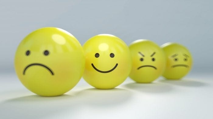 4 yellow balls with sad, happy, angry, and concerned faces