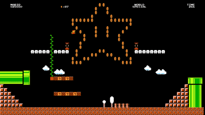 Screen shot of Super Mario with Mario jumping through the air to collect coins.