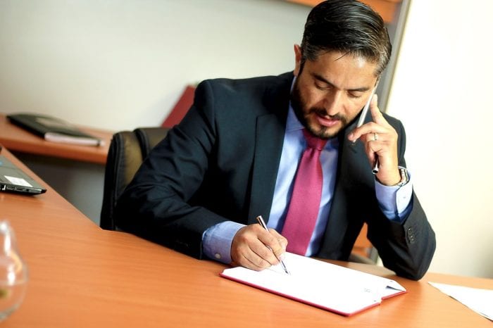 businessman in suit reviewing a legal document