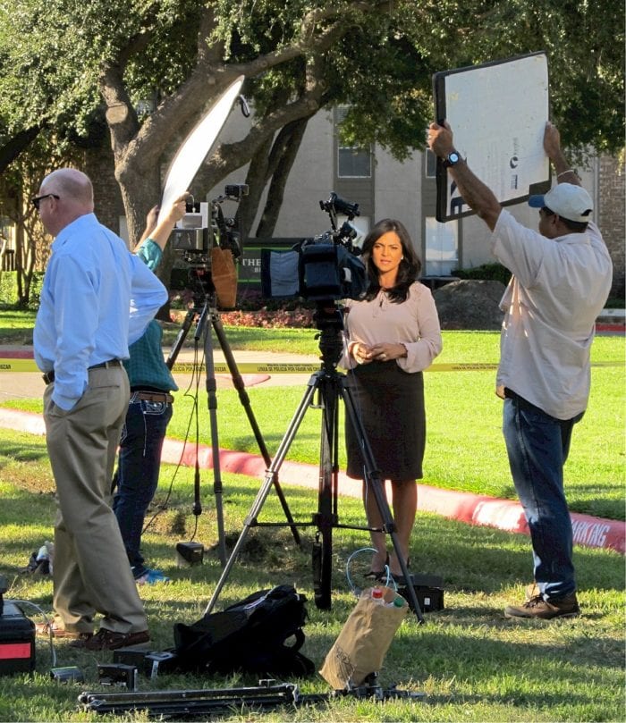 New reporter bringing news while news staff control sunlight and noise.