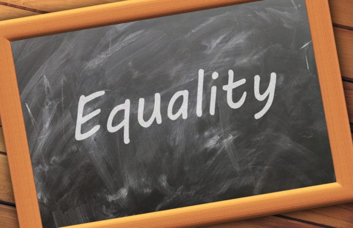 chalkboard with "equality" written on it