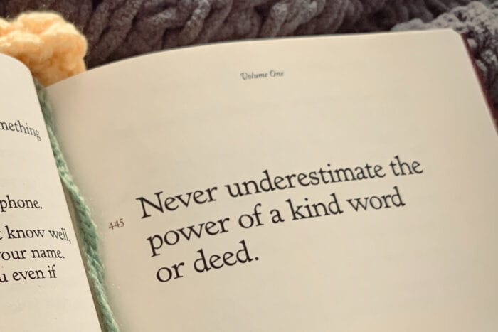 Close-up of a book with the words, "Never underestimate the power of a kind word or deed."