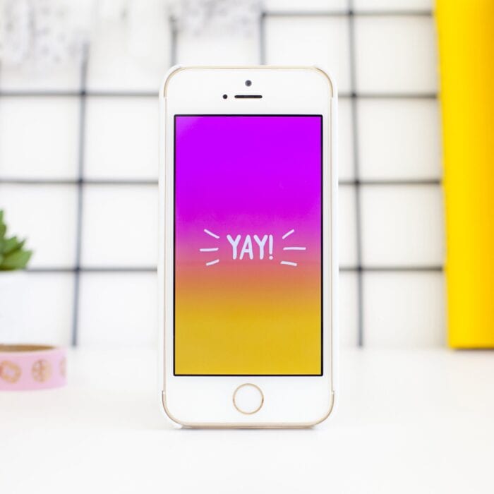 Cell phone with the word "yay" on the screen