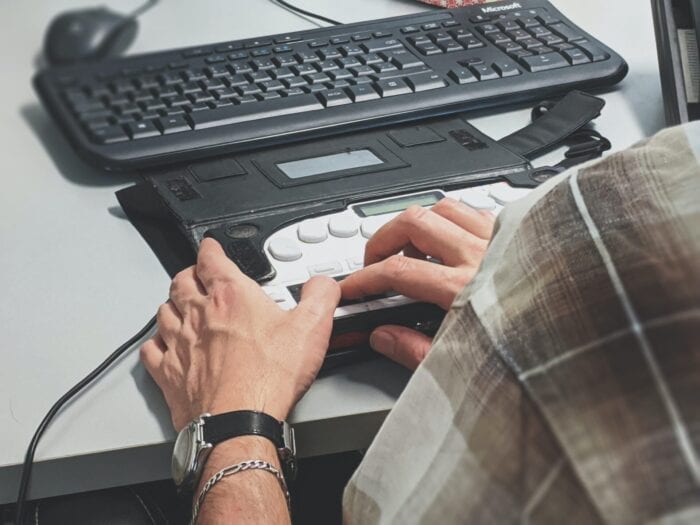 Looking over the shoulder of someone using a refreshable braille display