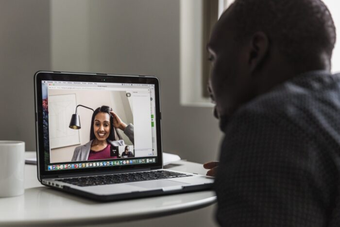 Coworkers using video chat to talk