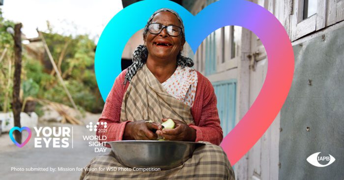 Women wearing glasses and smiling while peeling fruit in a bowl outside with the world sight day 2021 logo, love your eyes logo, and IAPB logo