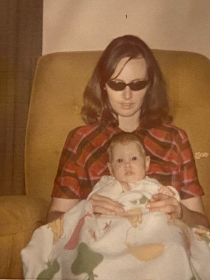 Photograph of the author's mom holding her as a baby.