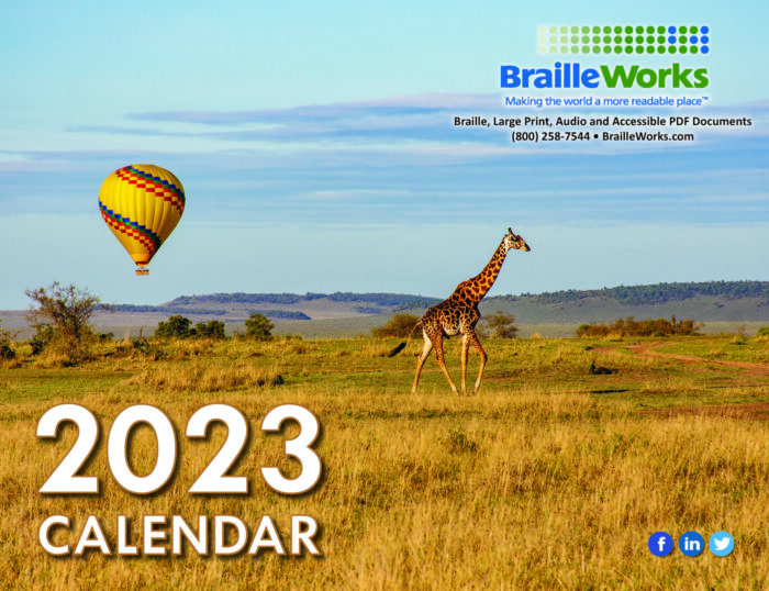 2023 Front cover with a giraffe walking in a field with a hot air balloon floating in the background