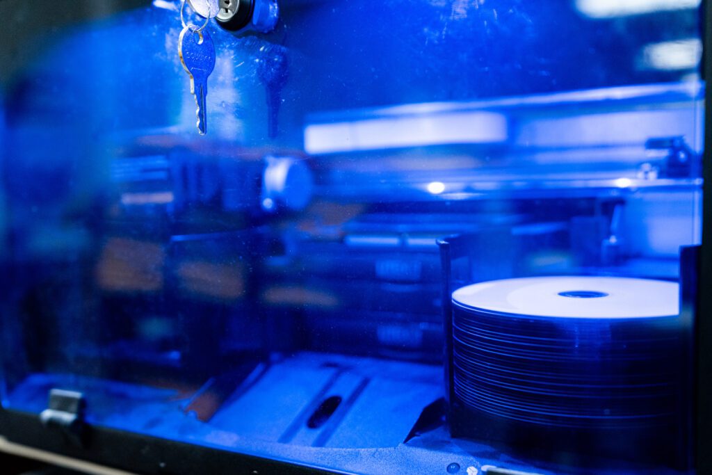 CD Burner for audio files with a key hanging out of the machine